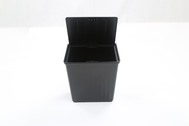 A product photo of a Tesla Y Rear Trash Can accessory on white background from an overhead view with the lid open