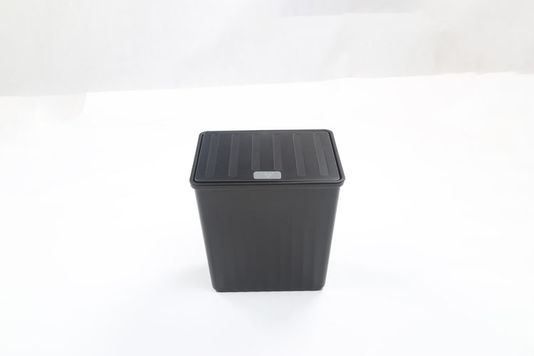 A product photo of a Tesla Y Rear Trash Can accessory on white background from an overhead view