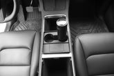 A view of the interior of the Tesla Y Cup Holder Accessory installed