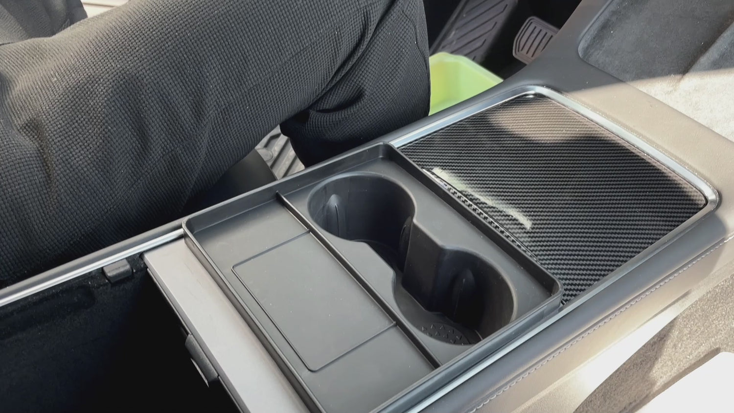 A video demonstrating the Tesla Y Cup Holder accessory